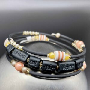 trust armband aprikos/gul din klara sol går åter opp