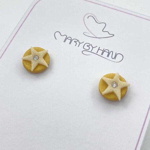 savior studs liten guld/pärlemor